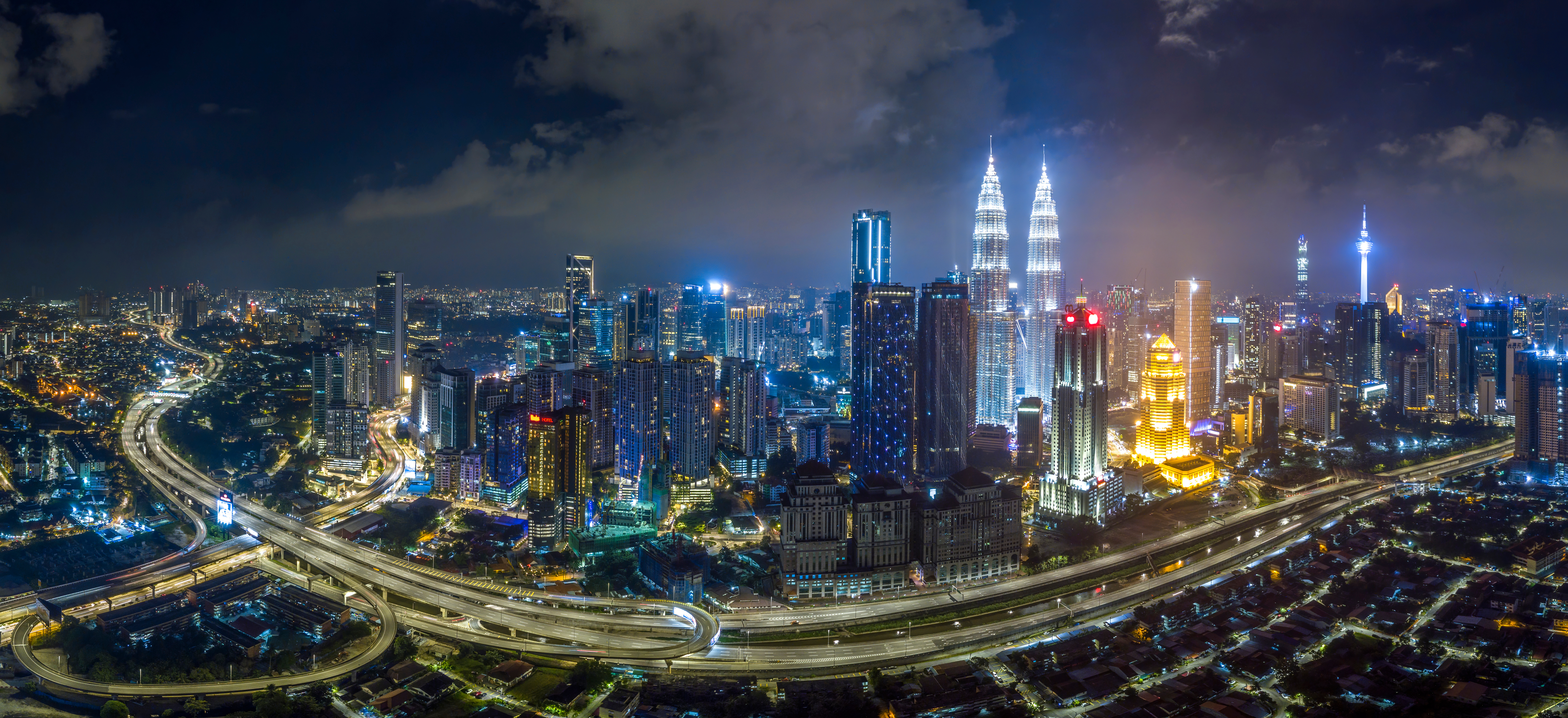 KUALA LUMPUR / Malaysia – 01 JAN 2020: Panorama aerial night view of downtown Kuala Lumpur Malaysia district skyline. logo removed Kuala Lumpur