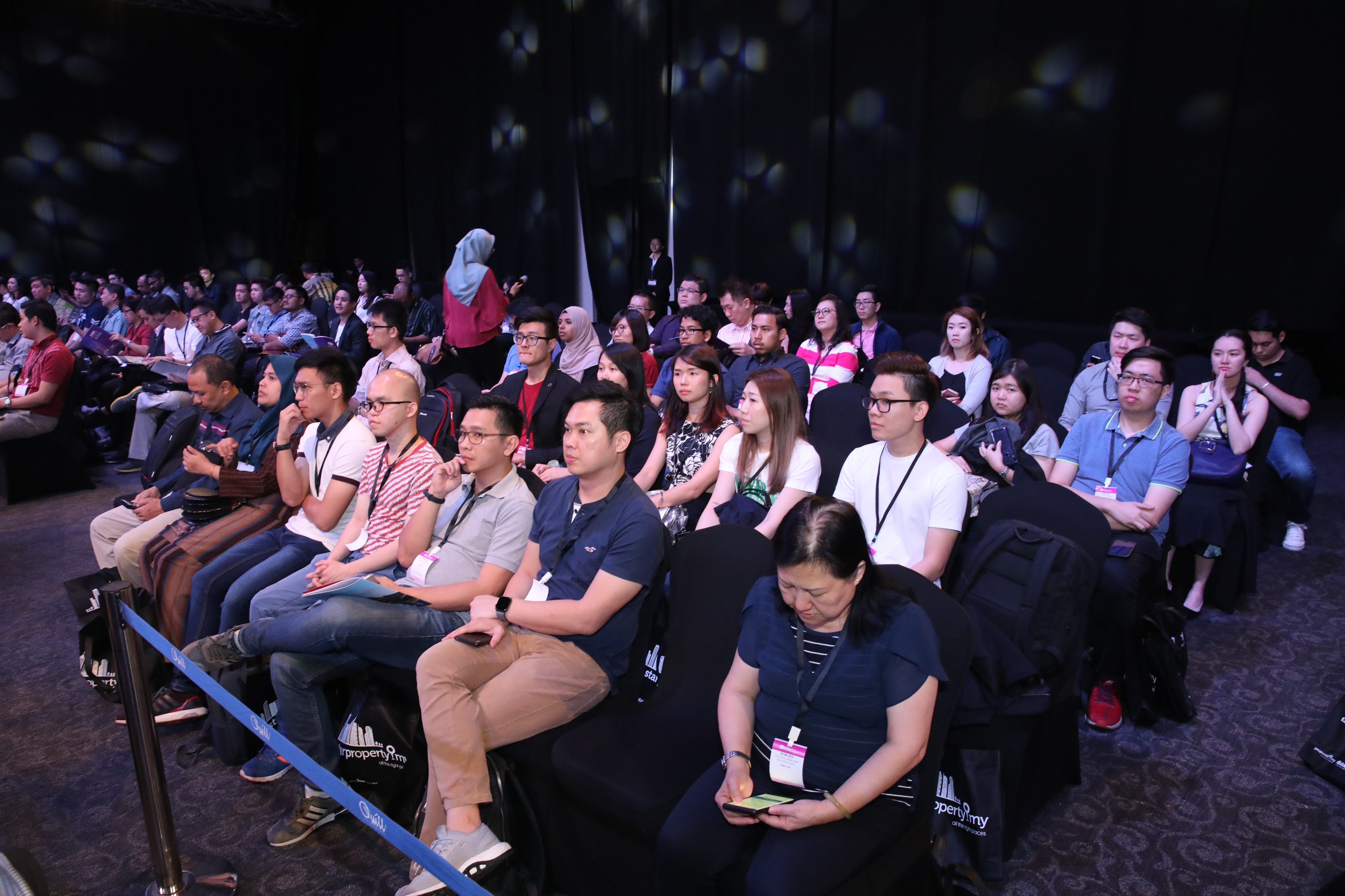 A view of the audience from a different perspective during a session.