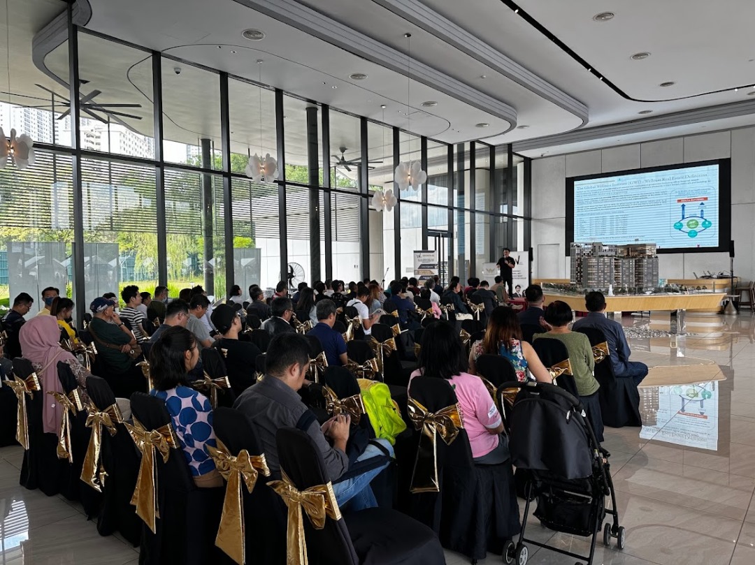 Attendees at the registration counter and networking at expo booths.
