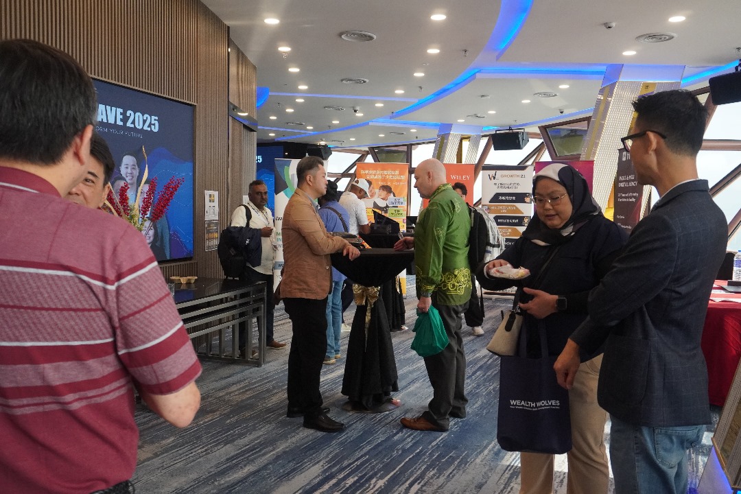 Audience members seated and engaged during a presentation.