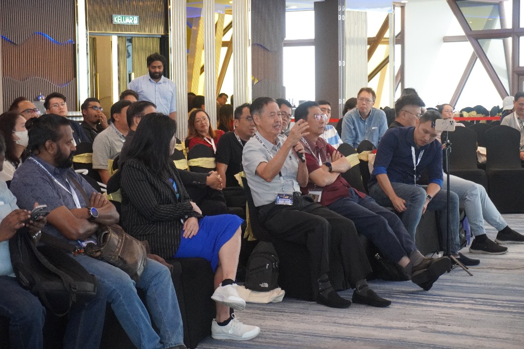 A view of the audience from a different perspective during a session.